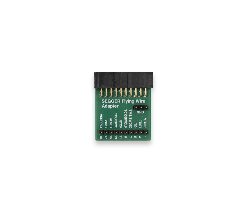 Image of a SEGGER Flying Wire Adapter, a small green printed circuit board with a connector at the top. The board features labeled pins for various functions, including GND, VREF, and TCK/SWDO. This adapter is used for programming and debugging embedded systems.