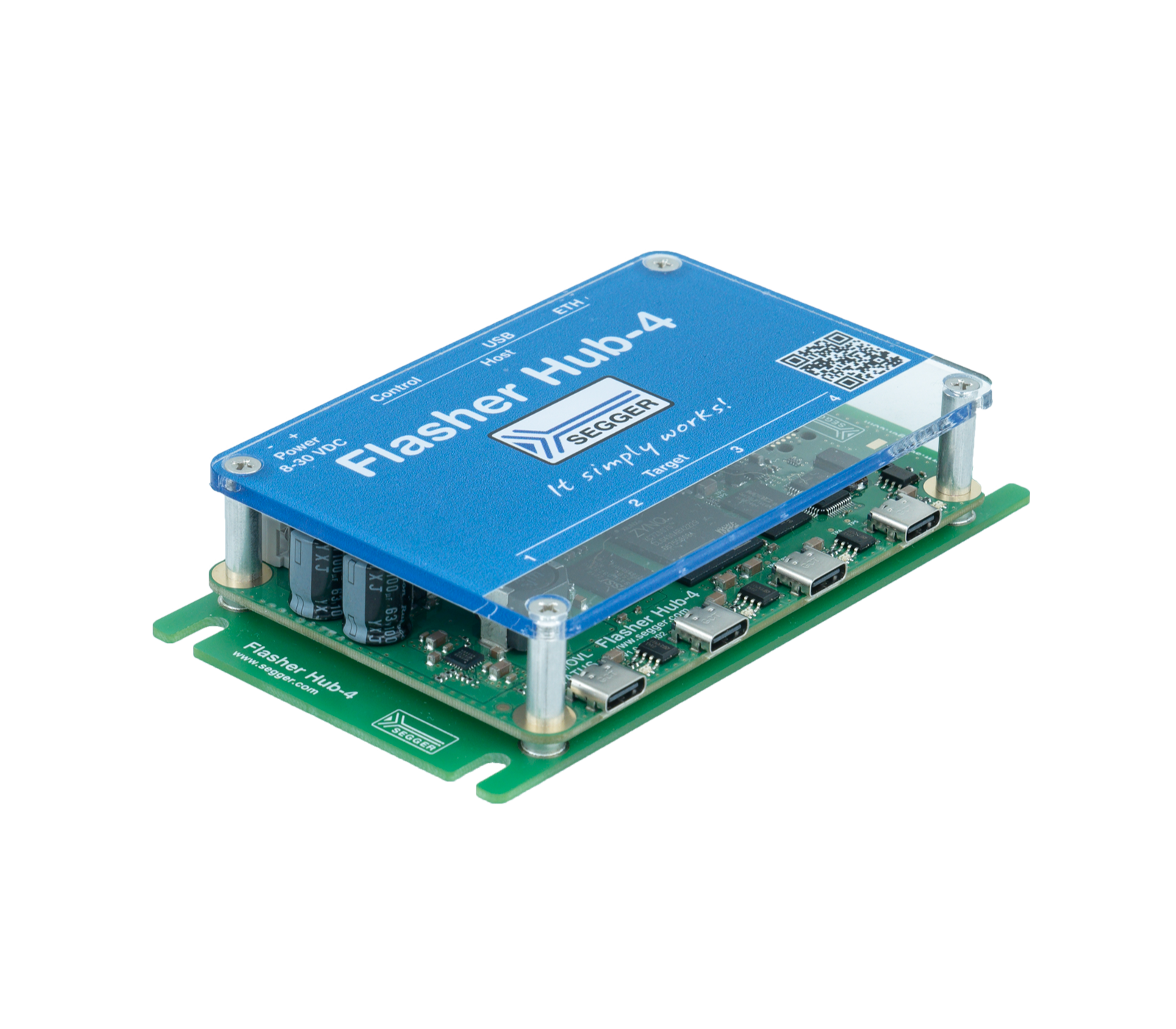 A blue electronic device labeled "Flasher Hub-4" sits atop a green circuit board. It features various ports, buttons, and a display, indicating its function in programming or device connectivity. The tagline "It simply works!" is also visible on the top.