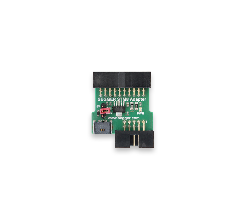 An electronic adapter board labeled "SEGGER STM8 Adapter" featuring various pin connectors, a small switch, and components for signaling. The board is primarily green with silkscreened details and is used for interfacing with STM8 microcontrollers.